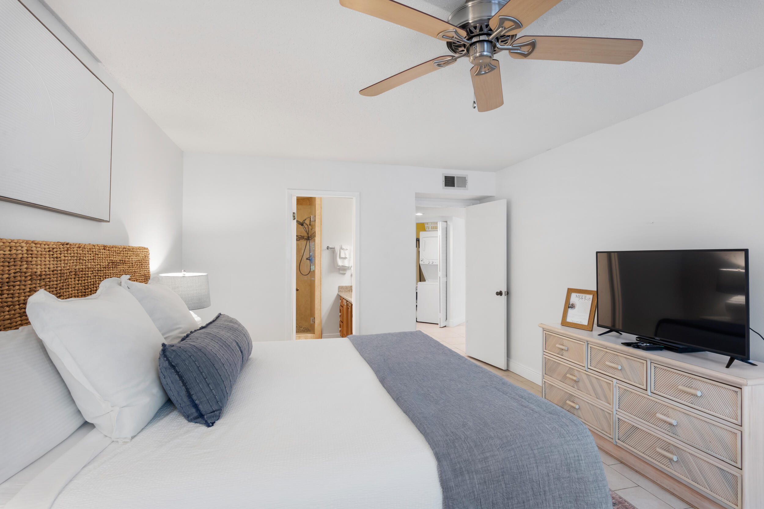 9815 Highway 98, Unit 144 Miramar Beach, FL 32550 - Photo 22 of 70 a bedroom with a bed and a flat screen tv