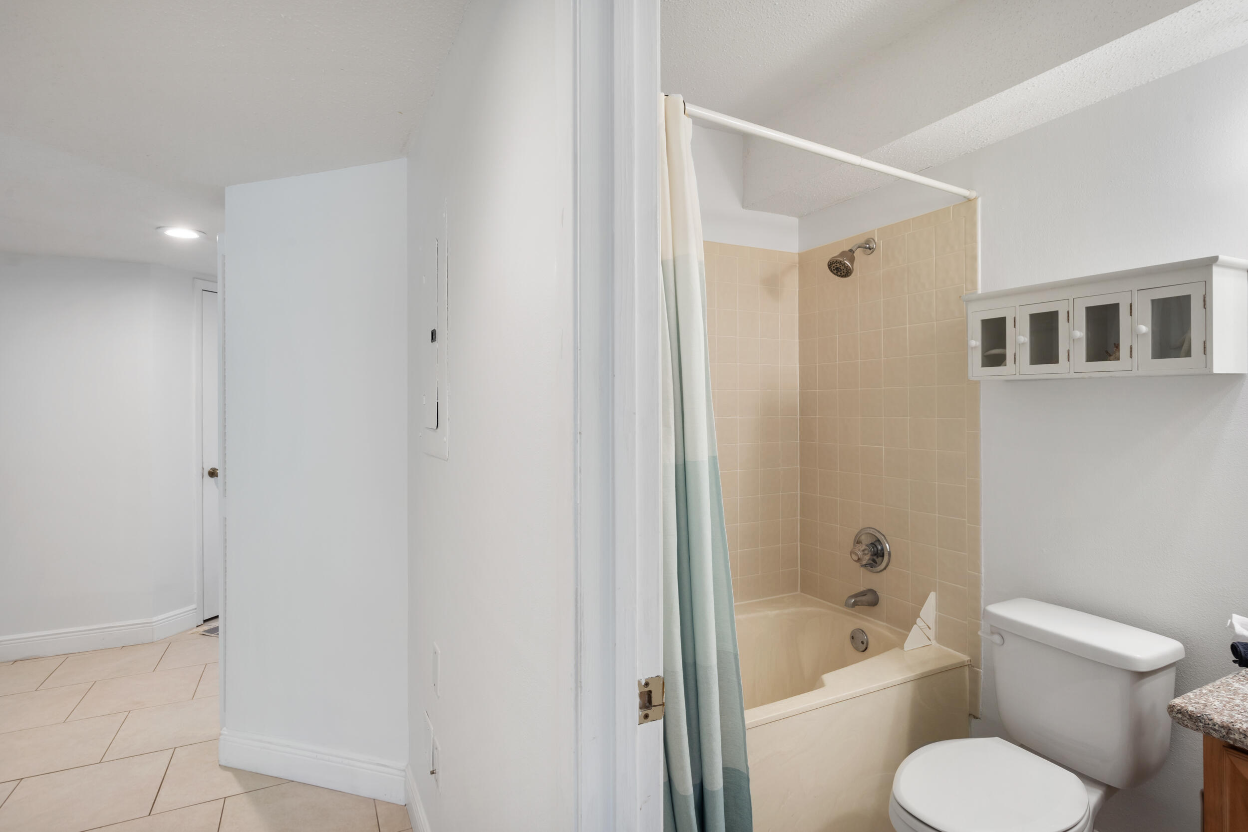 9815 Highway 98, Unit 144 Miramar Beach, FL 32550 - Photo 27 of 70 a white toilet sitting next to a bath tub