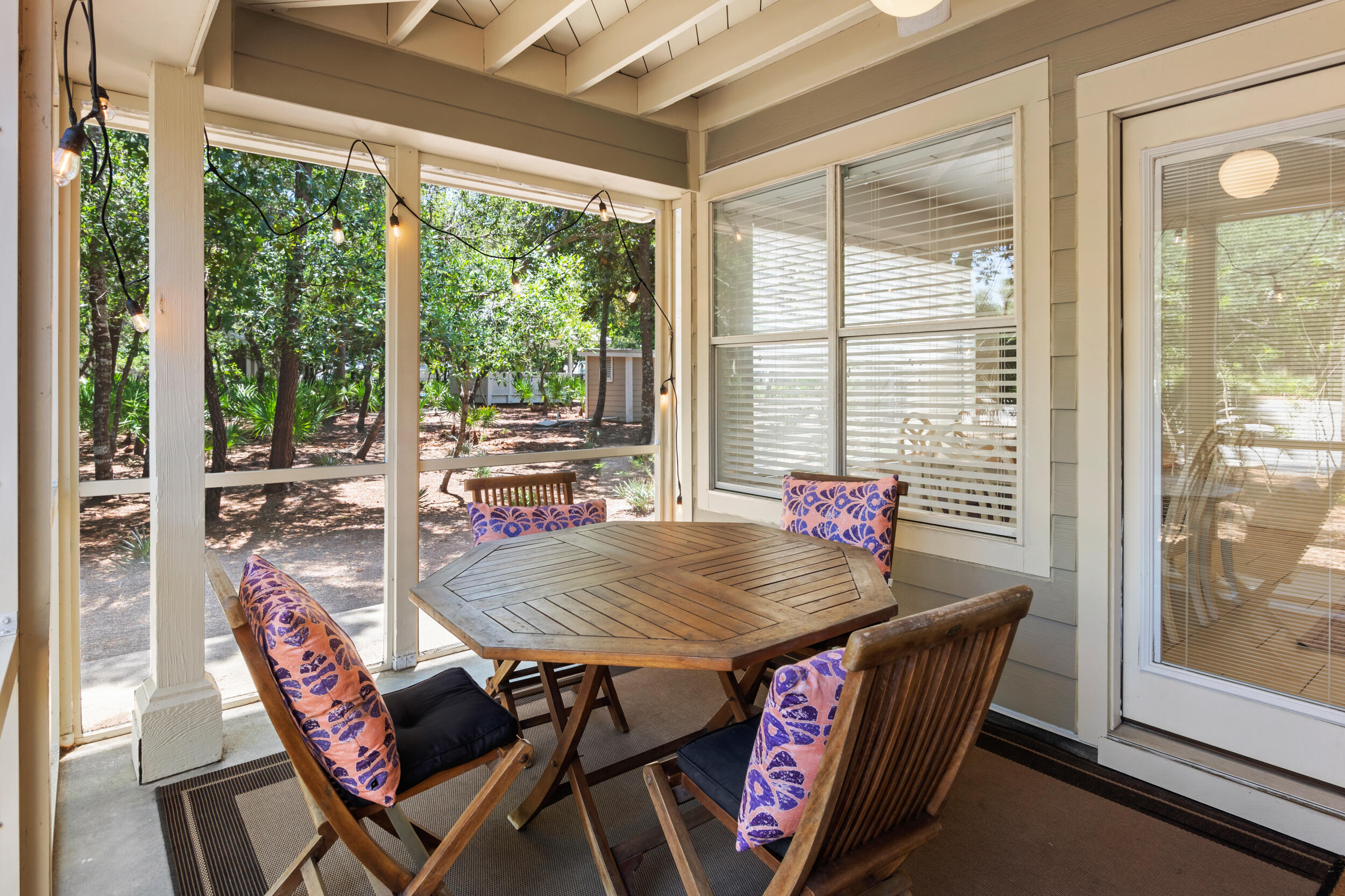 9815 Highway 98, Unit 144 Miramar Beach, FL 32550 - Photo 30 of 70 a view of a dining room with furniture large windows and wooden floor