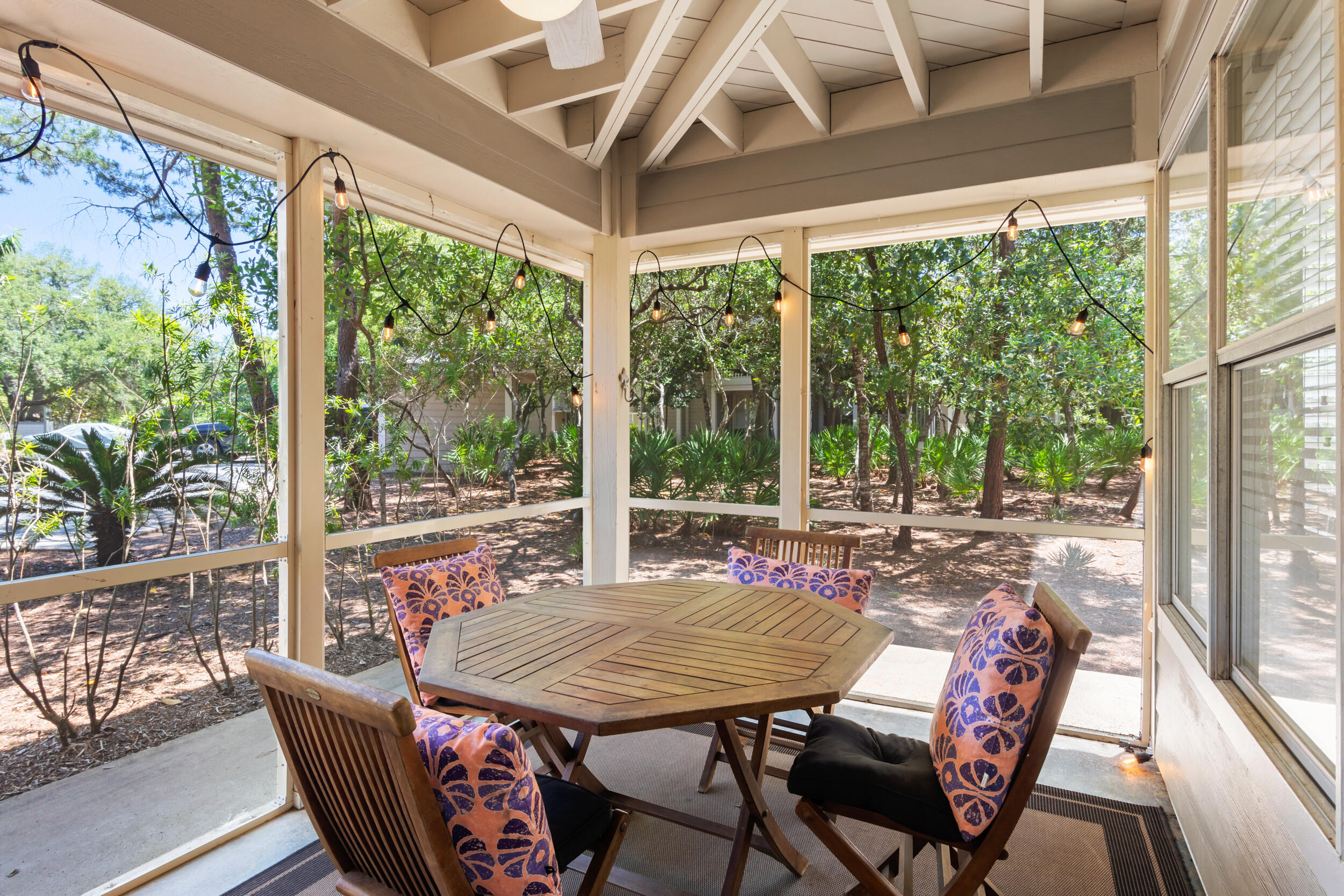 9815 Highway 98, Unit 144 Miramar Beach, FL 32550 - Photo 31 of 70 a view of a patio with a table chairs and a table