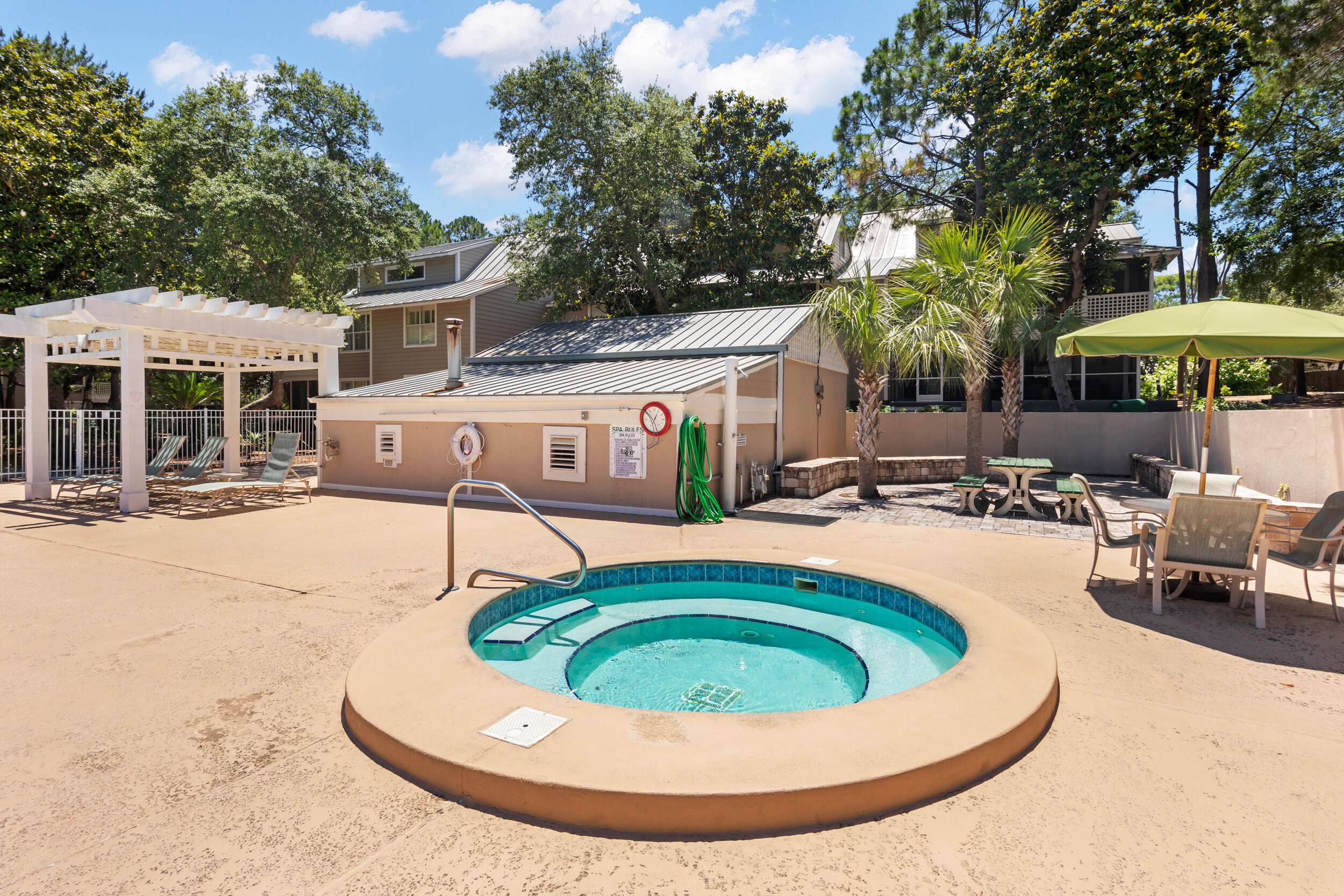 9815 Highway 98, Unit 144 Miramar Beach, FL 32550 - Photo 39 of 70 a view of a house with swimming pool and sitting area