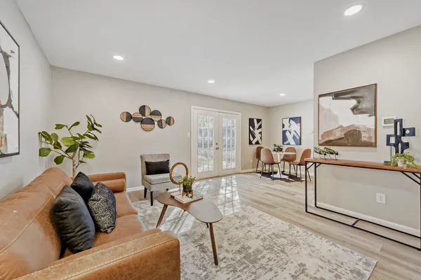 a living room with furniture and a table