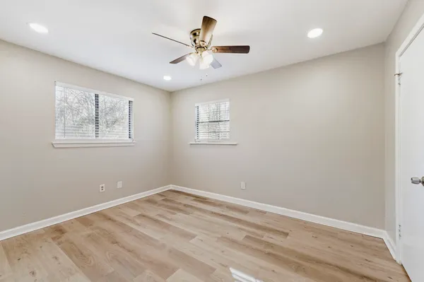a view of room with window and ceiling fan