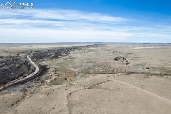 an aerial view of beach and city space