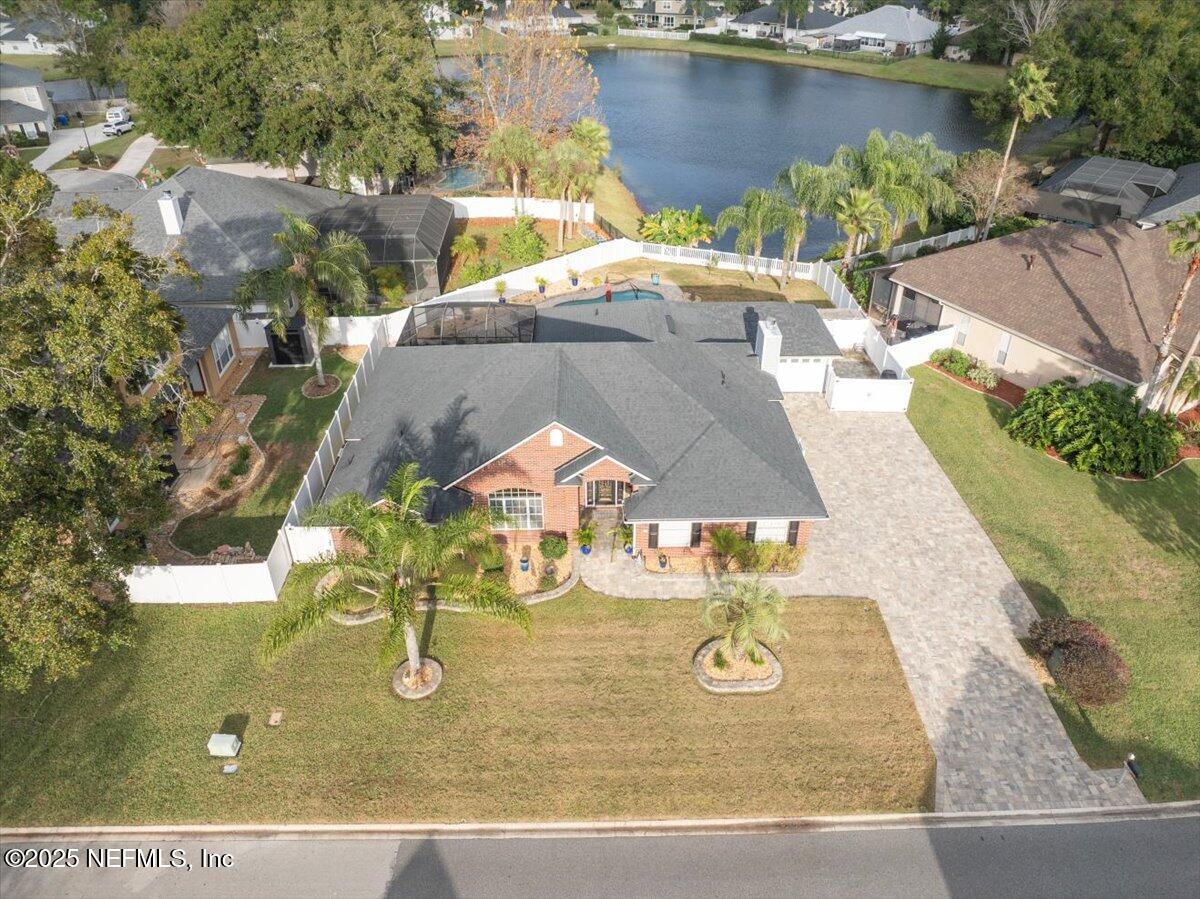 4032 Lonicera Loop St. Johns, FL 32259 - Photo 1 of 113 an aerial view of a house with swimming pool and patio