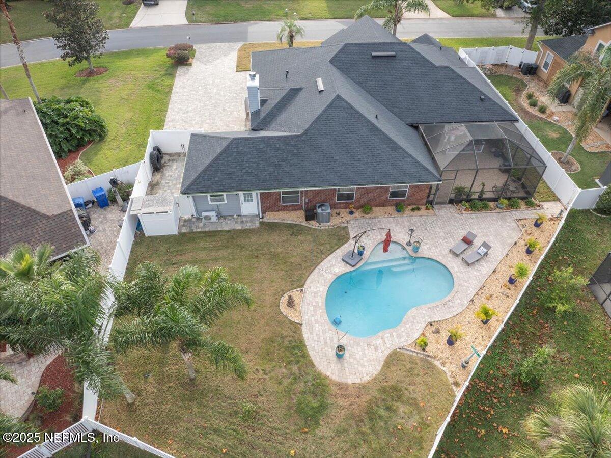 4032 Lonicera Loop St. Johns, FL 32259 - Photo 2 of 113 an aerial view of a house with a swimming pool