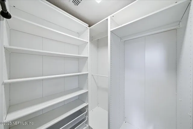 a front view of house with outdoor space and swimming pool