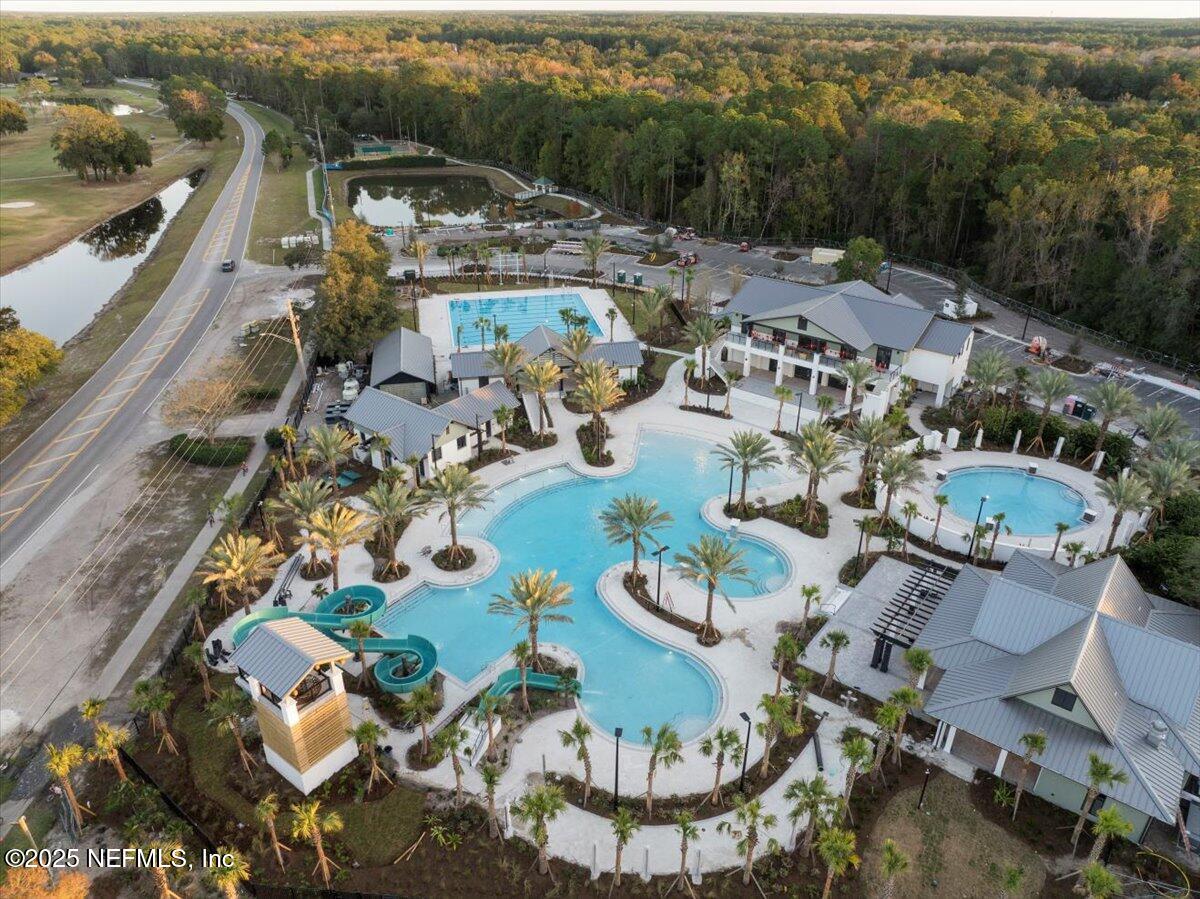 4032 Lonicera Loop St. Johns, FL 32259 - Photo 3 of 113 an aerial view of a swimming pool with outdoor seating