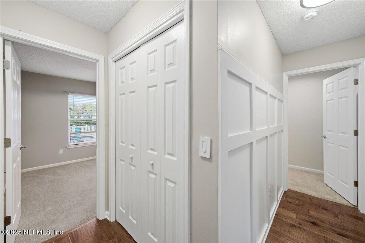 4032 Lonicera Loop St. Johns, FL 32259 - Photo 31 of 113 a view of a hallway with wooden floor and closet area
