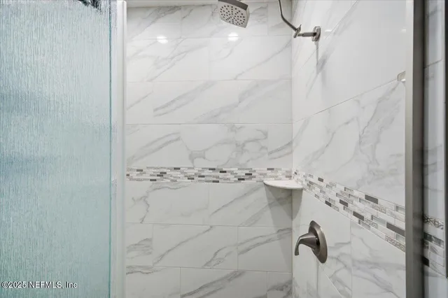 an aerial view of a house with swimming pool