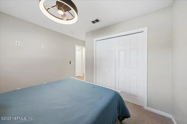 a backyard of a house with barbeque oven table and chairs