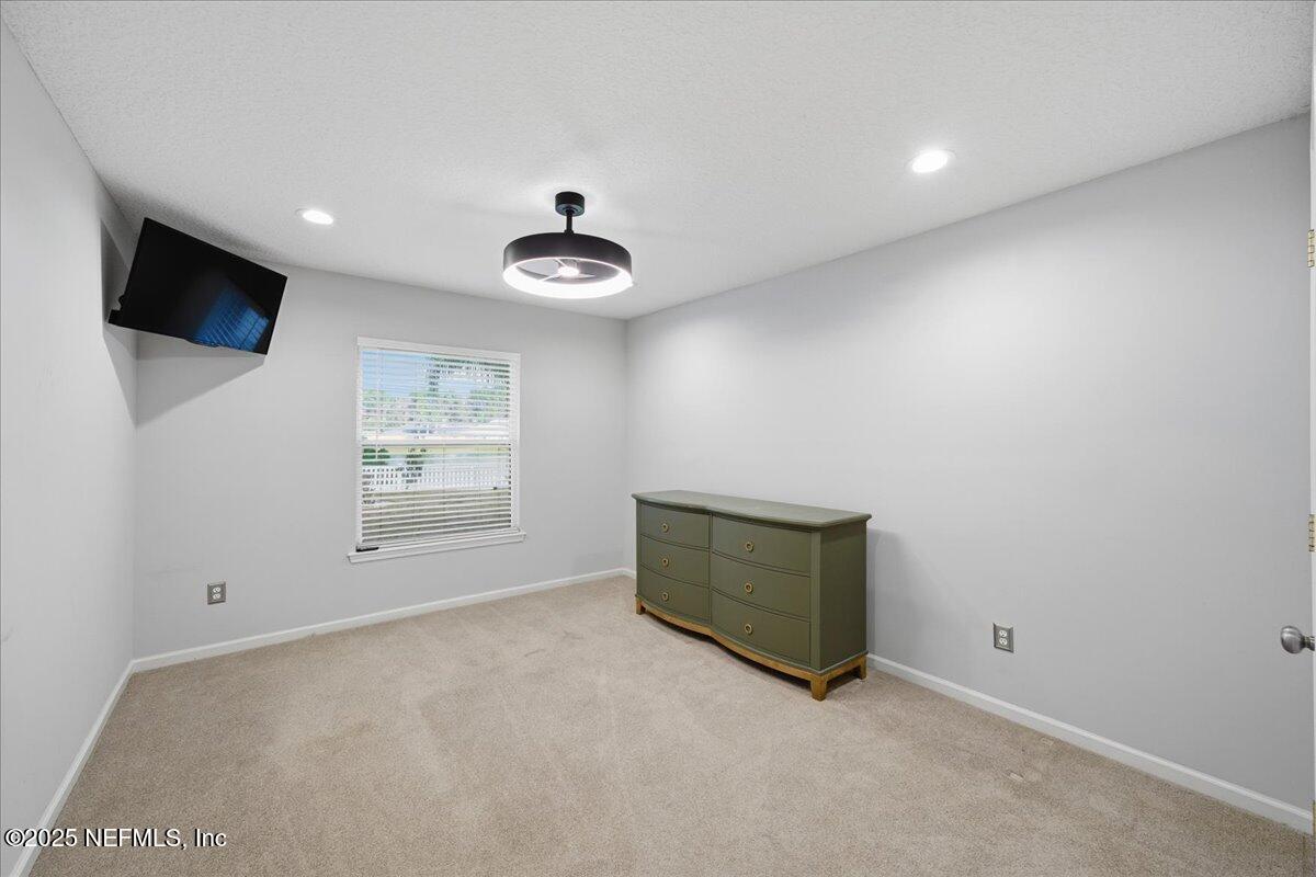 4032 Lonicera Loop St. Johns, FL 32259 - Photo 37 of 113 a room with window and a flat screen tv