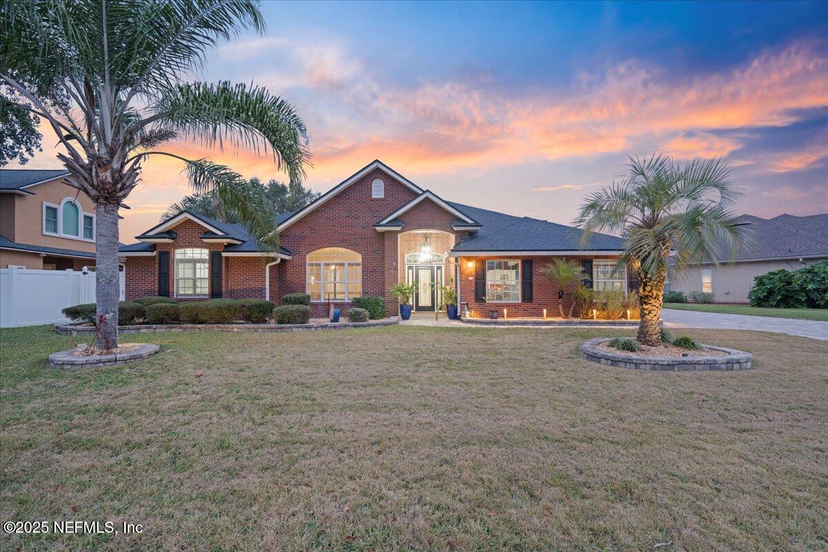 4032 Lonicera Loop St. Johns, FL 32259 - Photo 4 of 113 a view of a house with a yard and palm trees