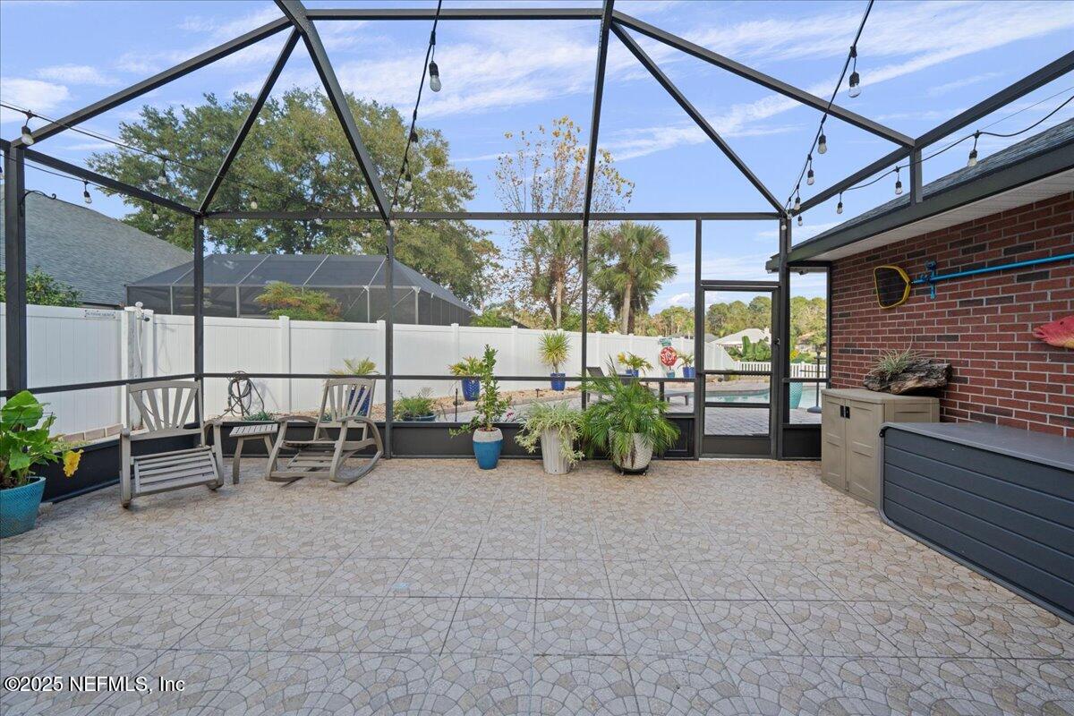 4032 Lonicera Loop St. Johns, FL 32259 - Photo 45 of 113 a view of a chairs and table in backyard of a house