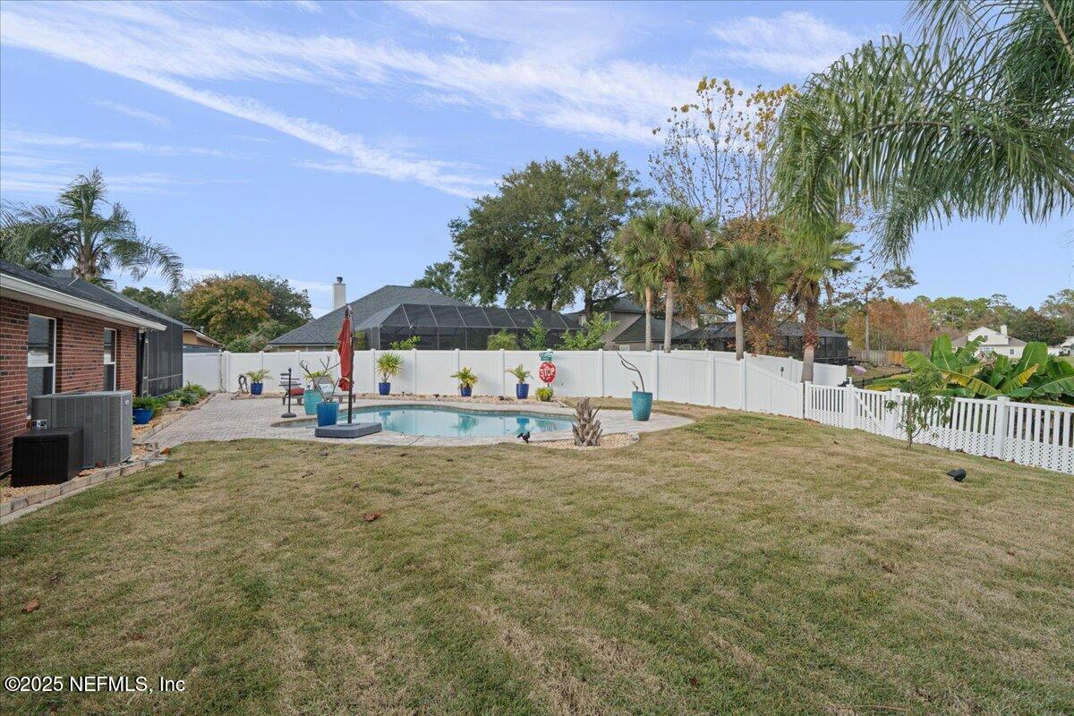 4032 Lonicera Loop St. Johns, FL 32259 - Photo 58 of 113 a view of yard with swimming pool and trees