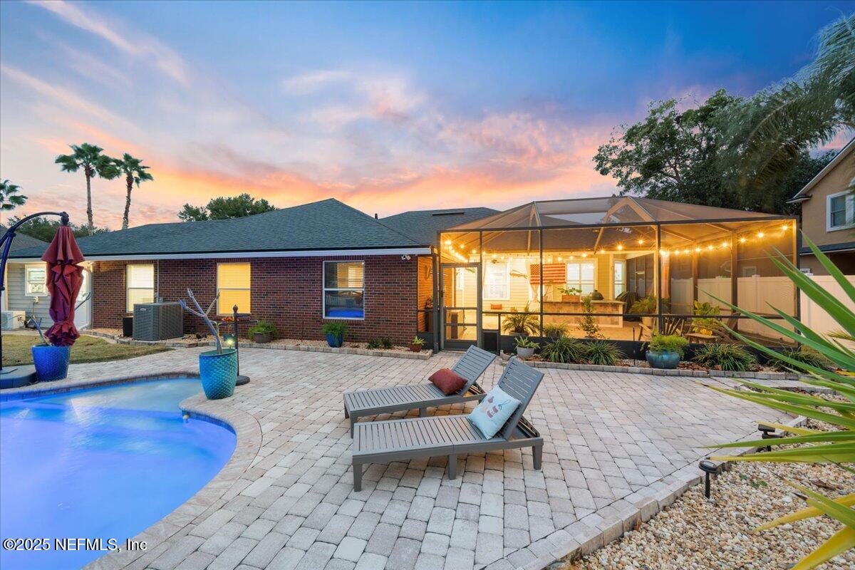 4032 Lonicera Loop St. Johns, FL 32259 - Photo 63 of 113 a backyard of a house with barbeque oven table and chairs