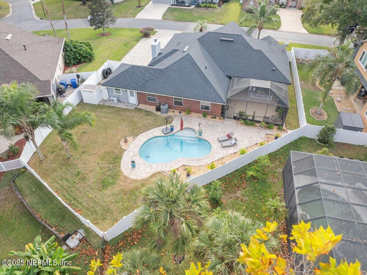 4032 Lonicera Loop St. Johns, FL 32259 - Photo 64 of 113 a view of a swimming pool with a yard
