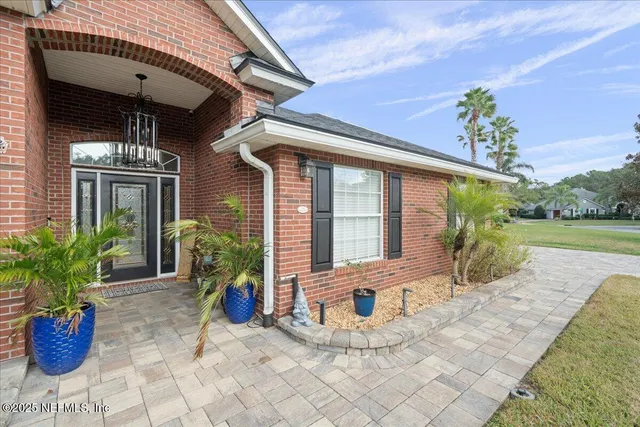 a large kitchen with kitchen island a sink stainless steel appliances and cabinets