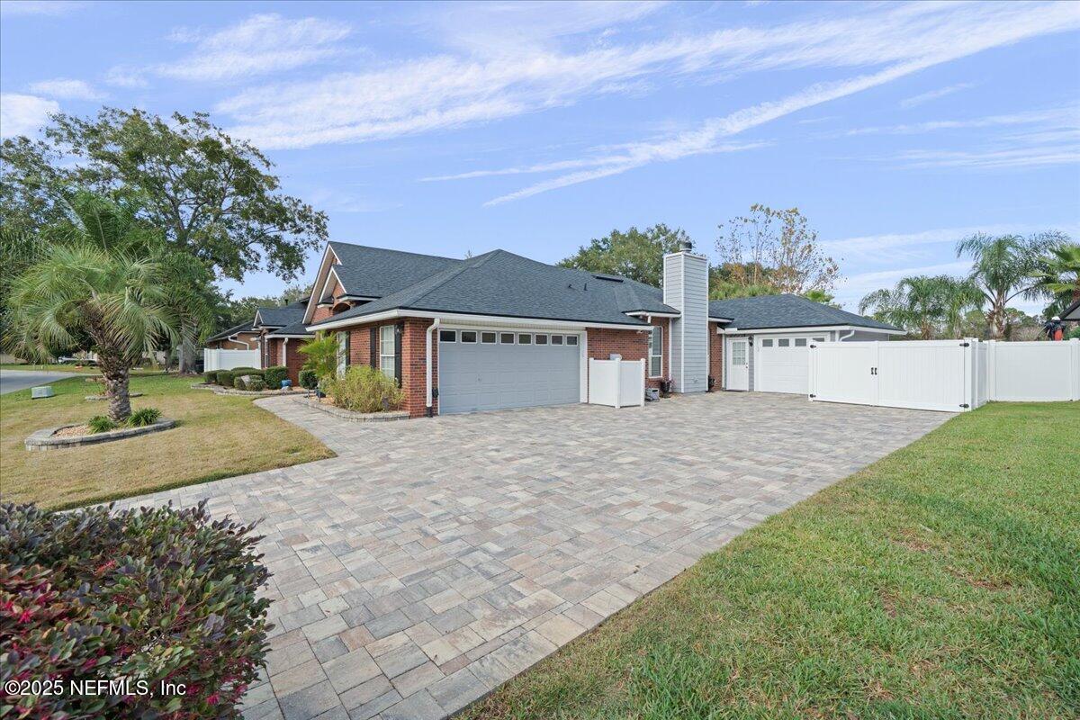 4032 Lonicera Loop St. Johns, FL 32259 - Photo 74 of 113 a view of a house with a yard and a large tree