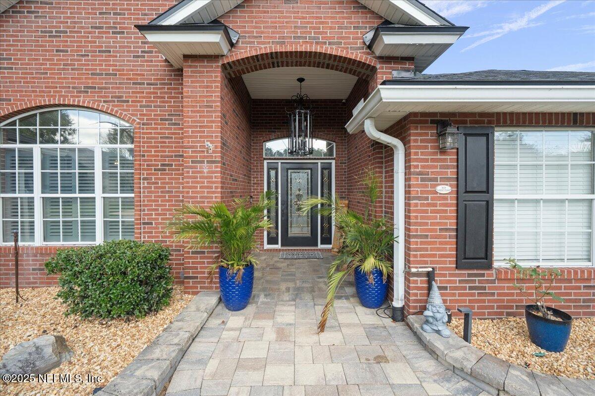 4032 Lonicera Loop St. Johns, FL 32259 - Photo 75 of 113 a view of a brick house with potted plants