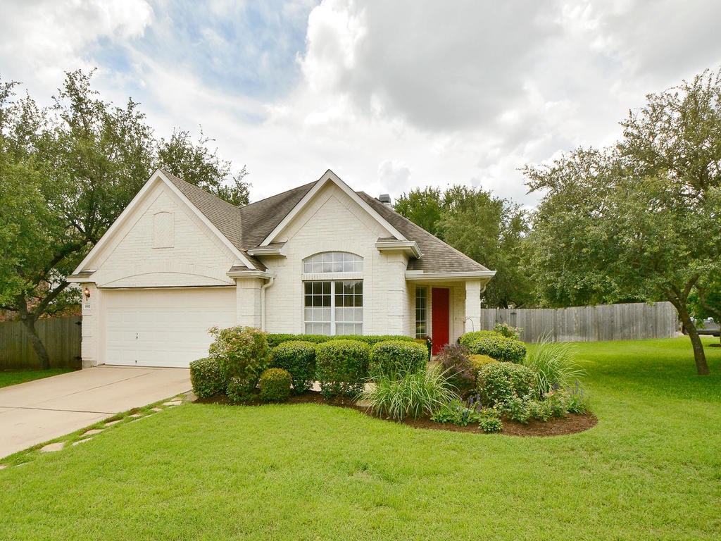 8811 Tiombe Bend Austin, TX 78749 - Photo 1 of 1 a front view of house with yard and green space