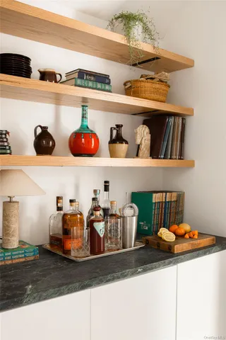 a view of a living room with kitchen furniture