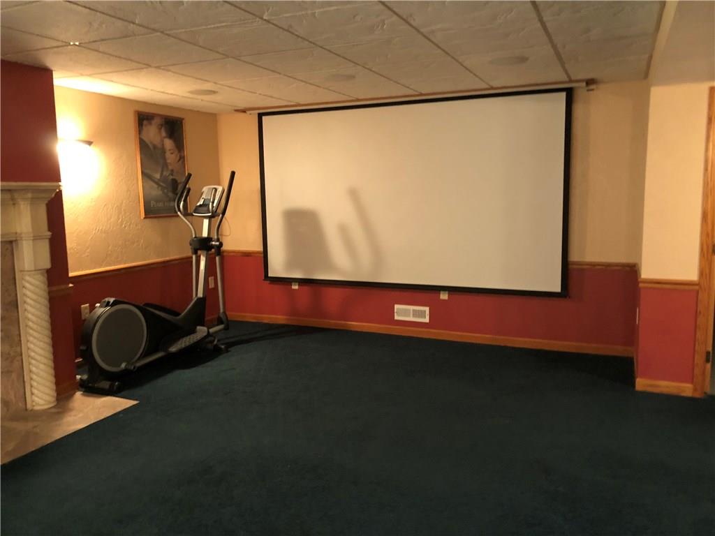 31 Dovercrest Road Eighty Four, PA 15330 - Photo 17 of 23 Game room has a rear projection theater style television with retractable screen.