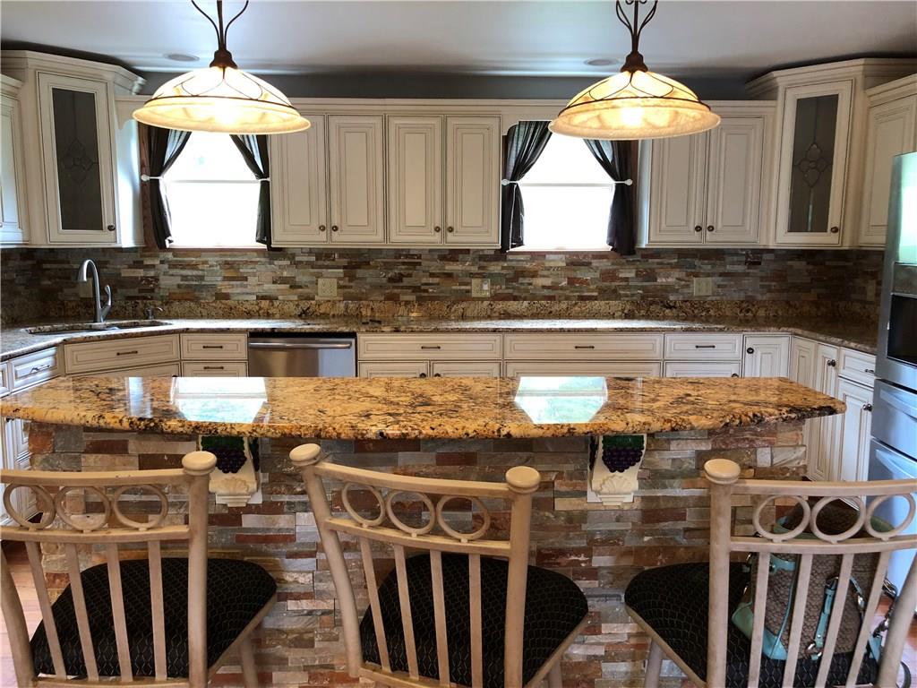 31 Dovercrest Road Eighty Four, PA 15330 - Photo 3 of 23 Granite kitchen with updated appliances with oversized large center island. Perfect for entertaining and culinary enthusiasts.