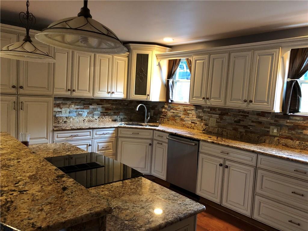 31 Dovercrest Road Eighty Four, PA 15330 - Photo 4 of 23 Beautiful kitchen with modern stainless appliances and granite galore.