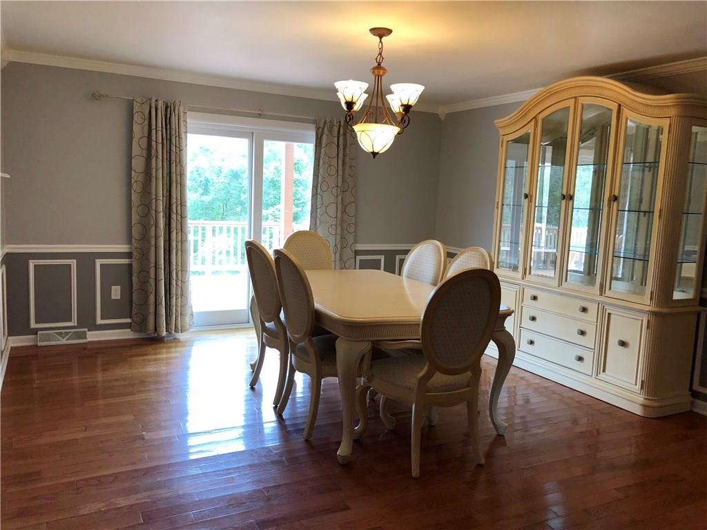 31 Dovercrest Road Eighty Four, PA 15330 - Photo 5 of 23 Dining room overlooks deck and rear yard with gleaming hardwood floors.