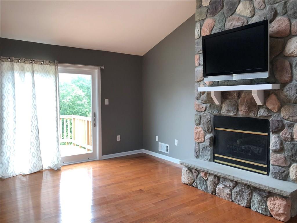 31 Dovercrest Road Eighty Four, PA 15330 - Photo 7 of 23 Master Bedroom with hardwood floors and propane fireplace which leads to the small deck viewing the rear of the property.