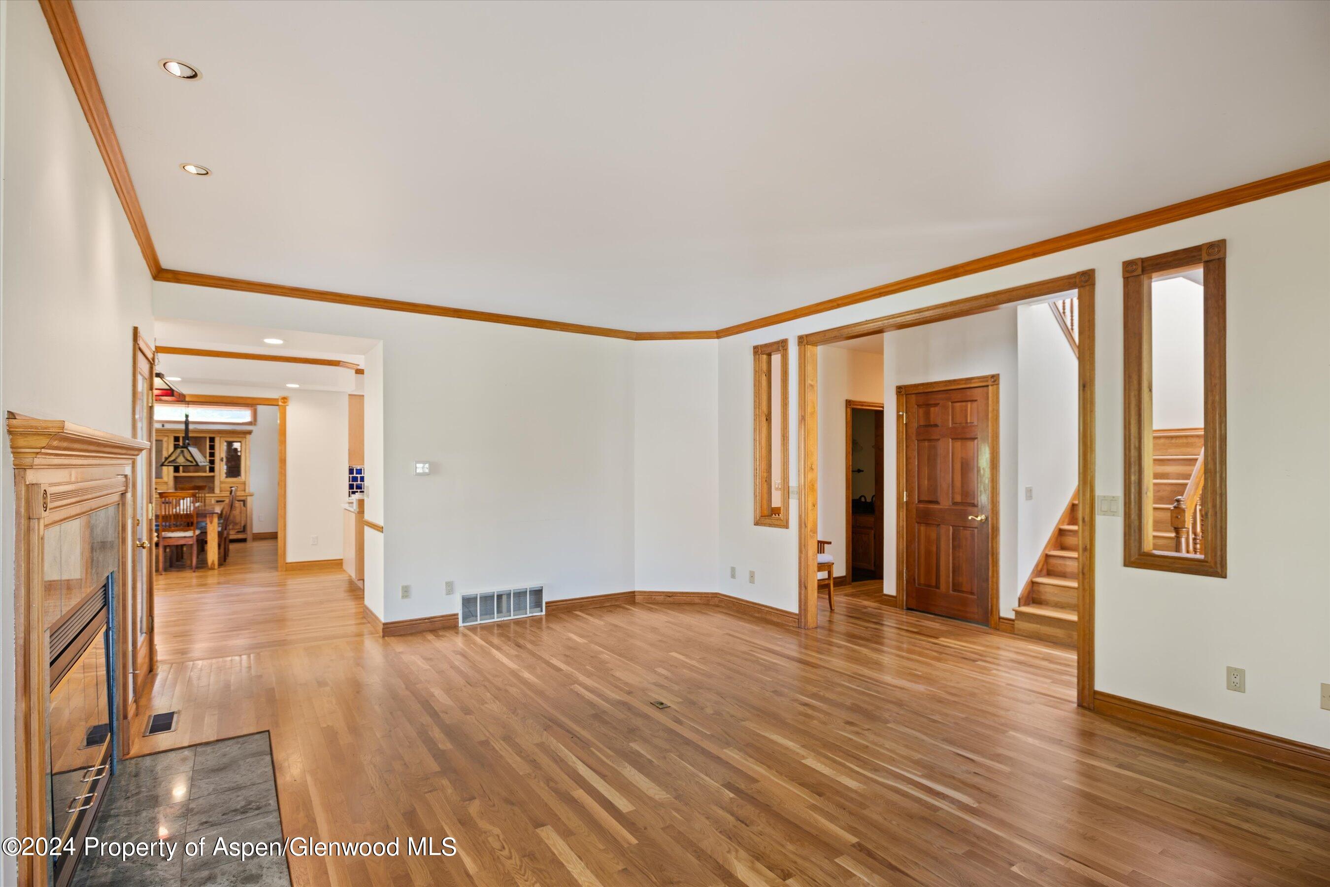 350 Riverside Drive Basalt, CO 81621 - Photo 14 of 46 a view of an empty room with wooden floor and a window