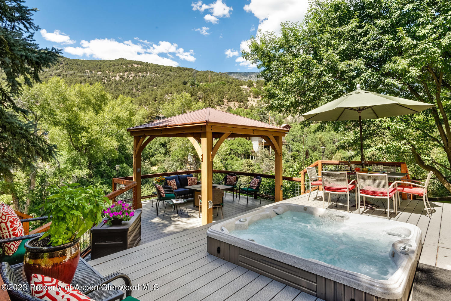 350 Riverside Drive Basalt, CO 81621 - Photo 3 of 46 an outdoor space with furniture and umbrella