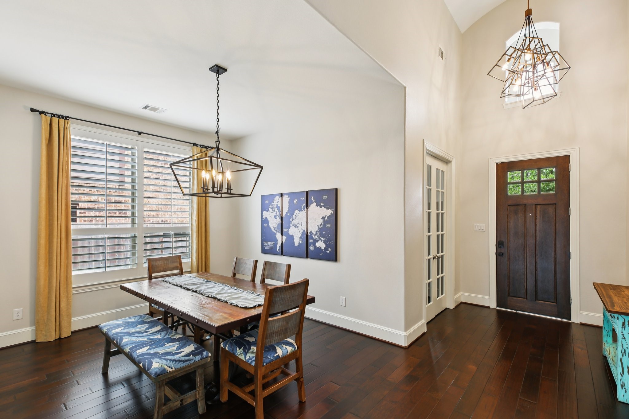 27914 Arden Trail Spring, TX 77386 - Photo 8 of 49 Elegant dining area featuring soaring high ceilings and striking contemporary lighting that creates a warm, inviting ambiance.