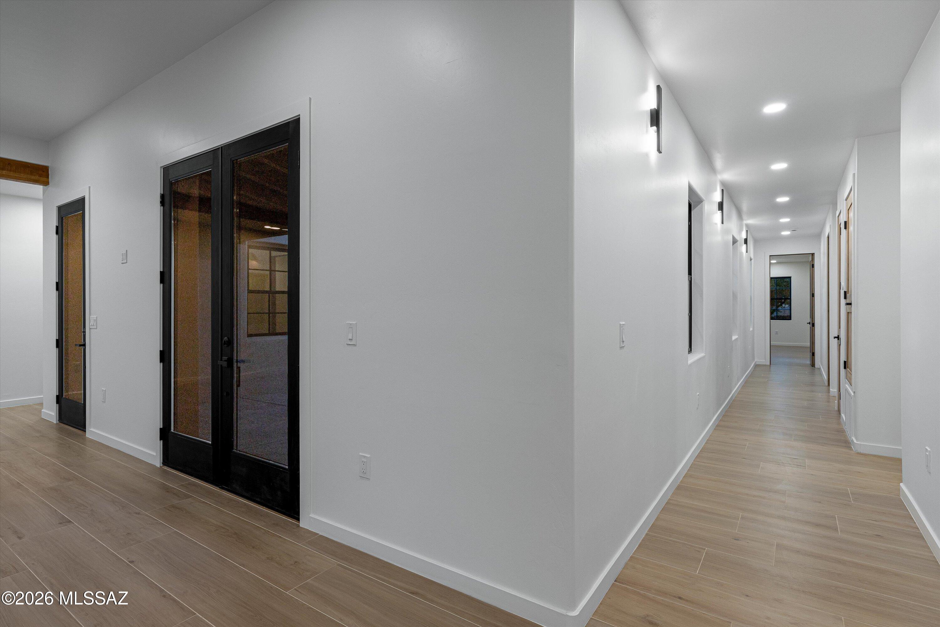 5259 East Fort Lowell Road Tucson, AZ 85712 - Photo 19 of 50 a view of a hallway with wooden floor