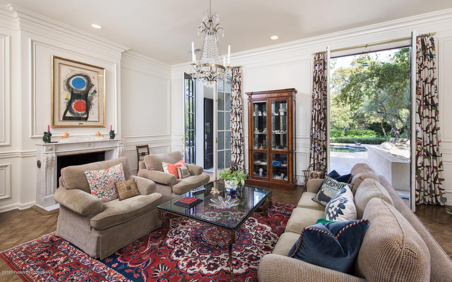 988 Buckingham Place Pasadena, CA 91105 - Photo 12 of 38 a living room with furniture and a chandelier