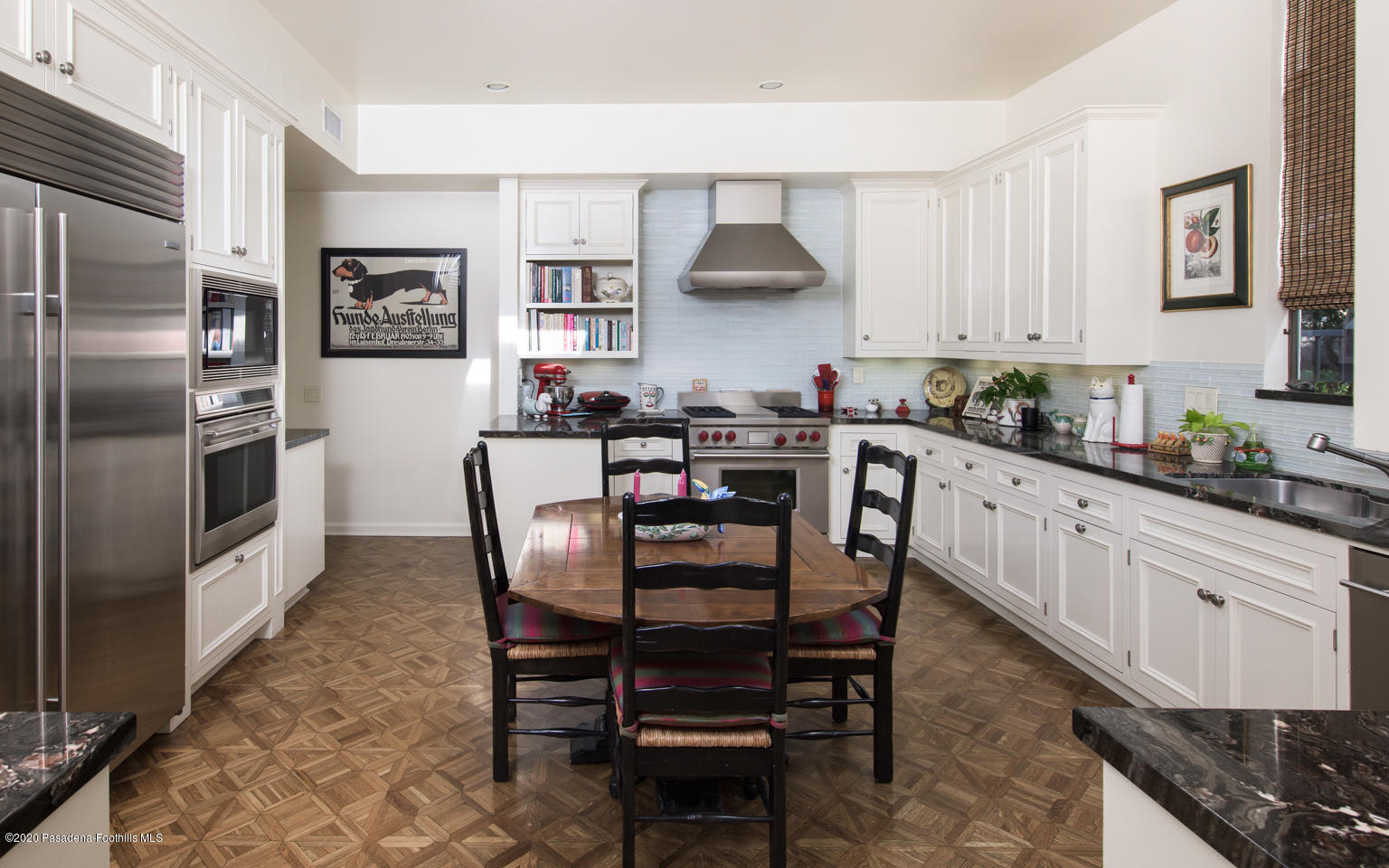 988 Buckingham Place Pasadena, CA 91105 - Photo 15 of 38 a kitchen with stainless steel appliances a dining table chairs and refrigerator