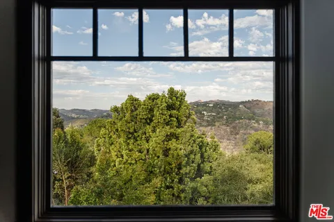 a view of a glass door with a black and white door