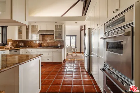 a bathroom with a sink and a large mirror