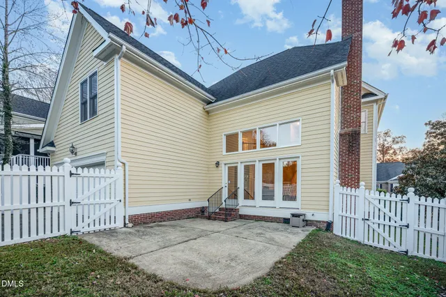 a utility room with cabinets washer and dryer