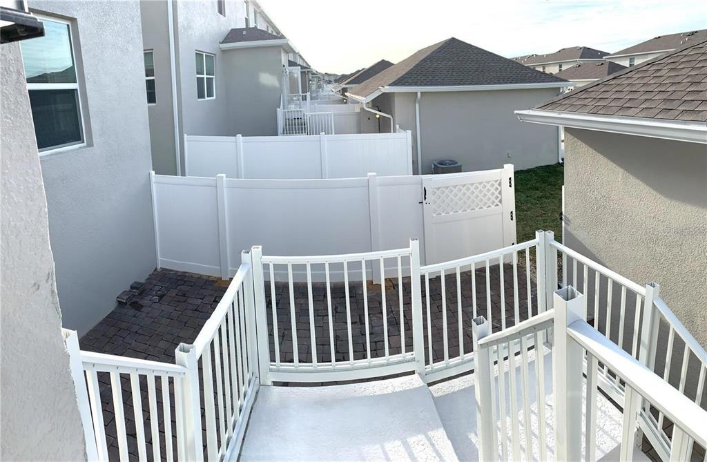 15609 Water Spring Boulevard Winter Garden, FL 34787 - Photo 21 of 36 a view of a house with wooden fence
