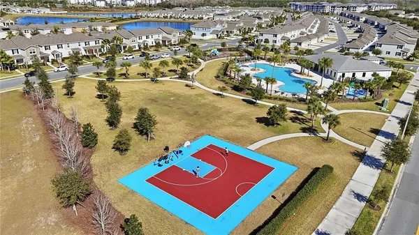an aerial view of residential houses with outdoor space