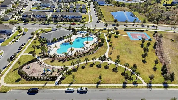 an aerial view of residential houses with outdoor space