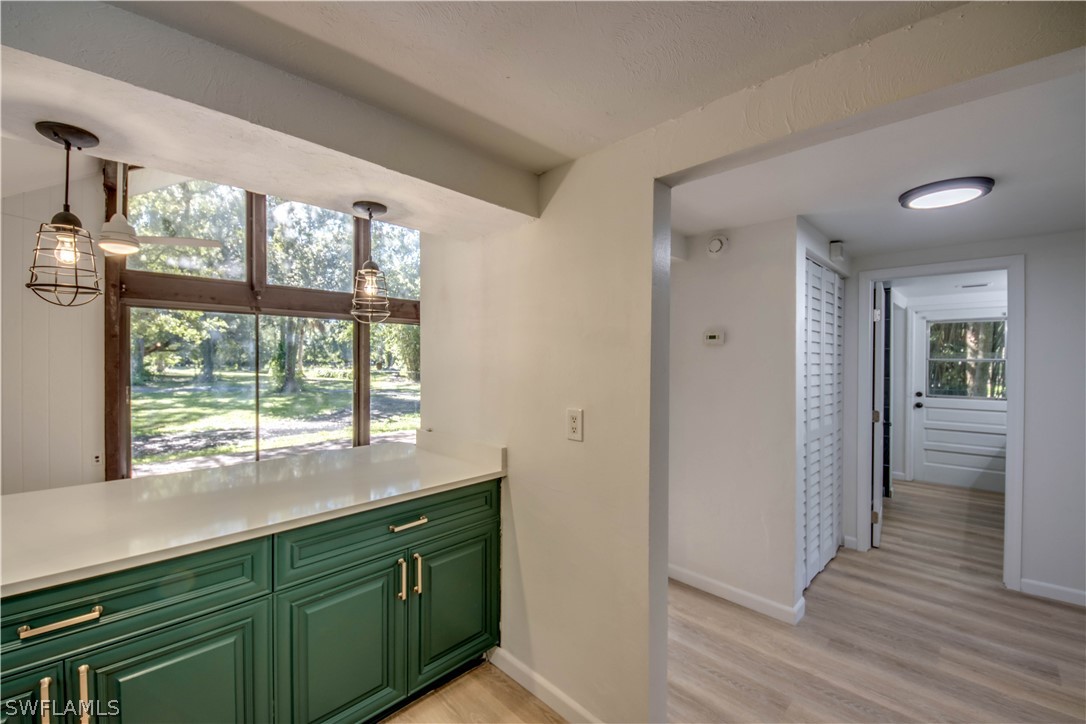 275 Trader Road Fort Denaud, FL 33935 - Photo 14 of 32 a kitchen with granite countertop a large window and a sink
