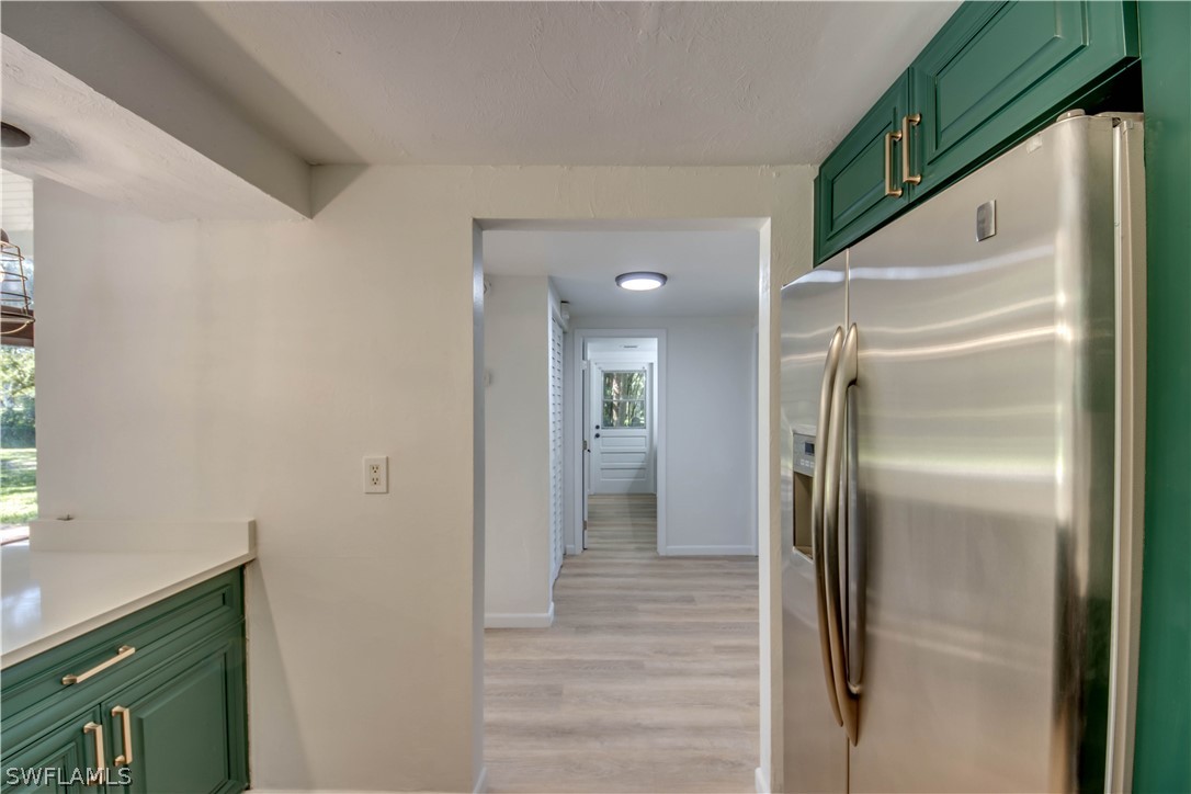 275 Trader Road Fort Denaud, FL 33935 - Photo 15 of 32 a view of a kitchen from a hallway
