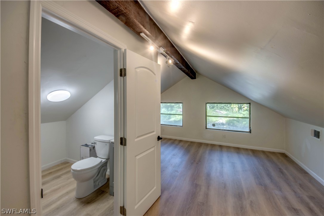 275 Trader Road Fort Denaud, FL 33935 - Photo 23 of 32 a bathroom with a toilet sink and a mirror