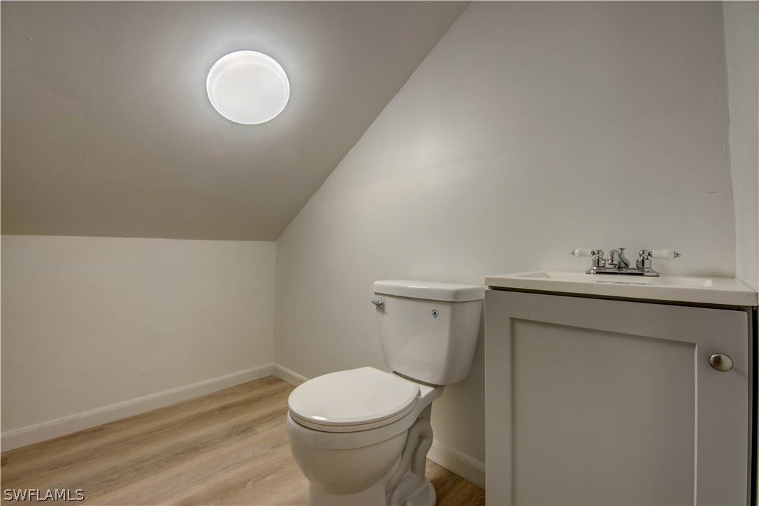 275 Trader Road Fort Denaud, FL 33935 - Photo 25 of 32 a bathroom with a sink mirror vanity and toilet