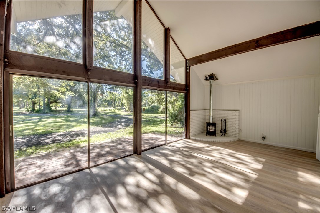 275 Trader Road Fort Denaud, FL 33935 - Photo 4 of 32 a view of an empty room with a floor to ceiling window