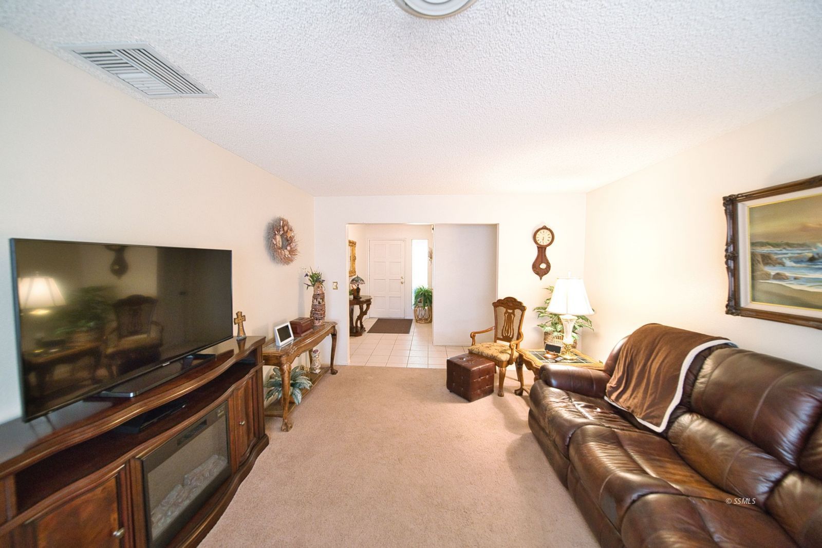 1024 Sherri Street Ridgecrest, CA 93555 - Photo 9 of 41 a living room with furniture and a flat screen tv