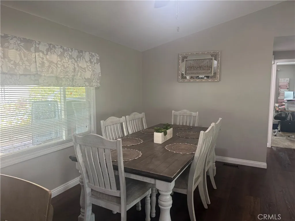 15181 Van Buren, Unit 47 Riverside, CA 92504 - Photo 6 of 20 a view of a dining room with furniture window and wooden floor